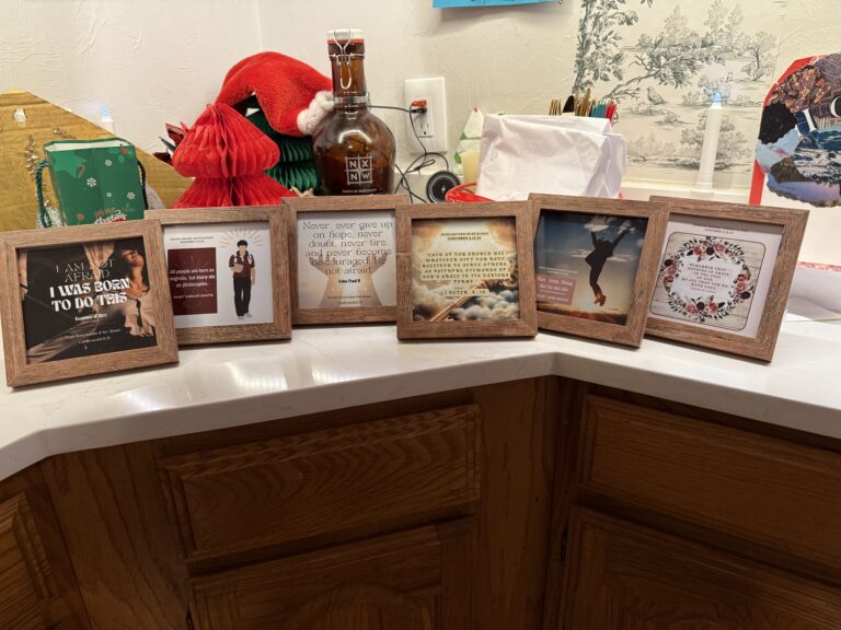 six frames on a countertop with various religious images