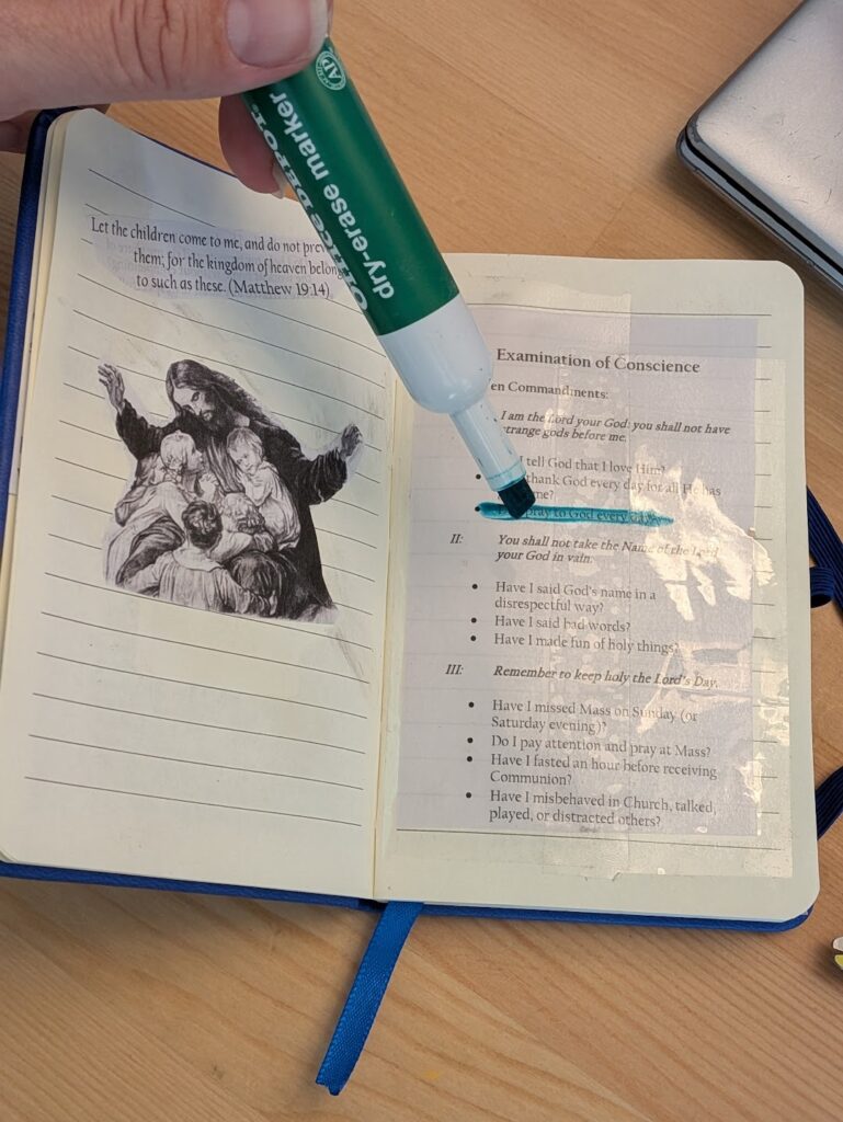 image of someone putting stickers in a notebook and highlighting words on the page, creating a meaningful handmade gift